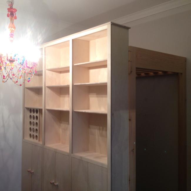 mezzanine bed and bookcase wall