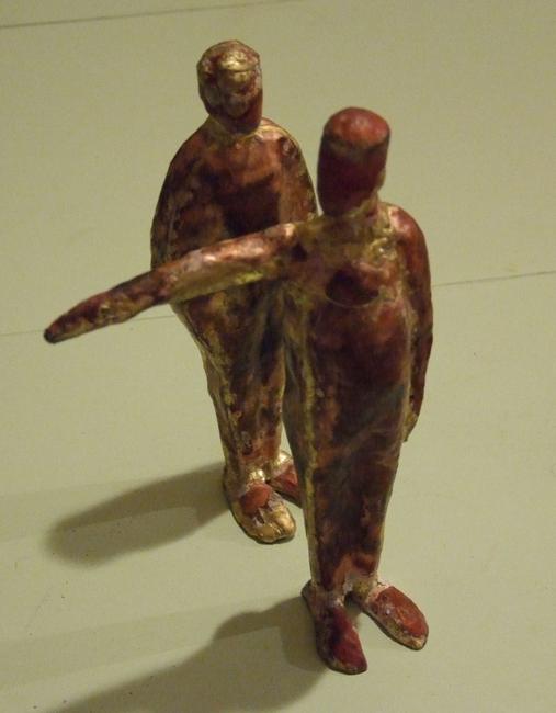 two figures, one pointing