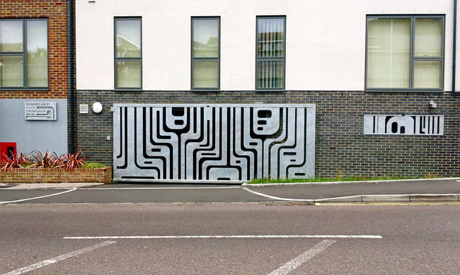 Diamond Court gate, grills, and signage