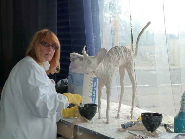 Lynn working on her cat sculpture