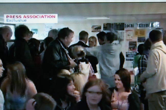 Photo from TV footage of boy throwing an egg at David Cameron in election campaign