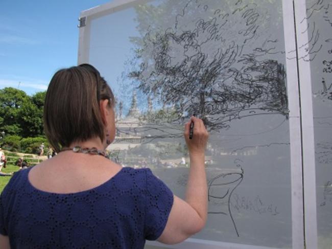 Sally Booth drawing inside Drawing Tent