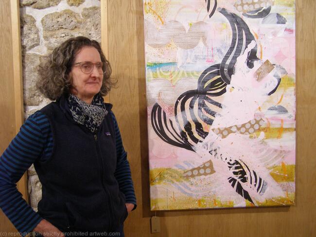 Artist with her painting Quirk at Ruskin Mill Gallery