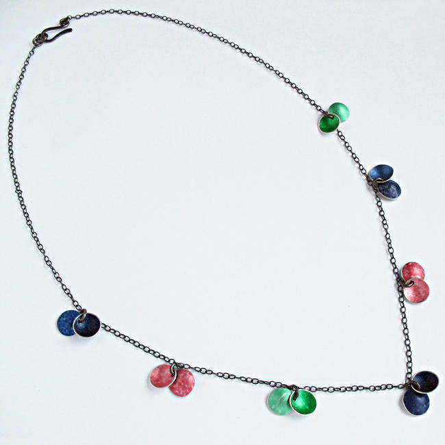 CD19 14 concave disc necklace in green, peach and indigo.