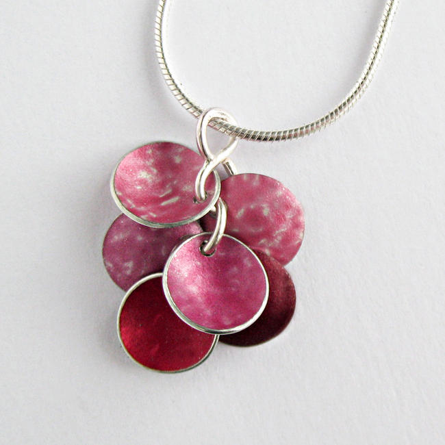 CD20 Six concave disc pendant in peach, pink and red.