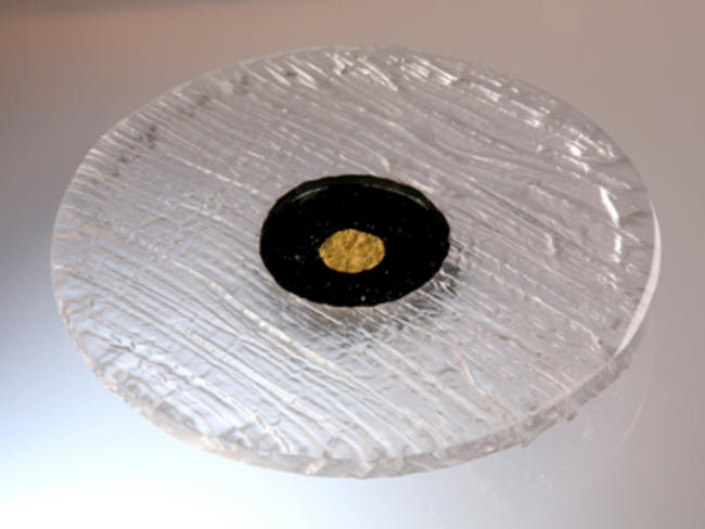 Salver - clear glass with black base inlaid with 23.5ct gold