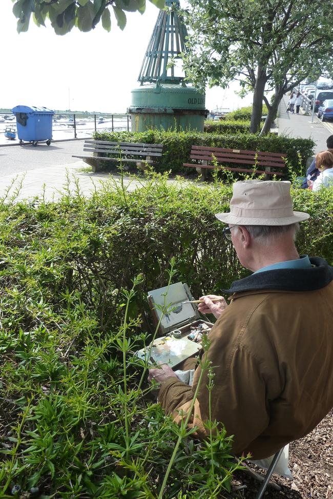 Trevor Chamberlain, iding behind a hedge, Leigh on Sea