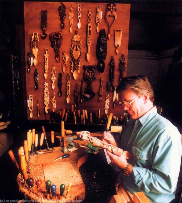 Mike carving in his studio