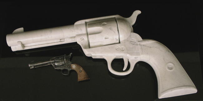 'Peacemaker - the gun', Colt 45 Peacemaker, carved Carrara marble, 3 x life size 776 x 401 x 125mm. Sold to private collection.
