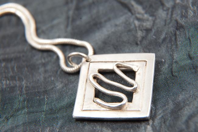 Square pendant with squiggle