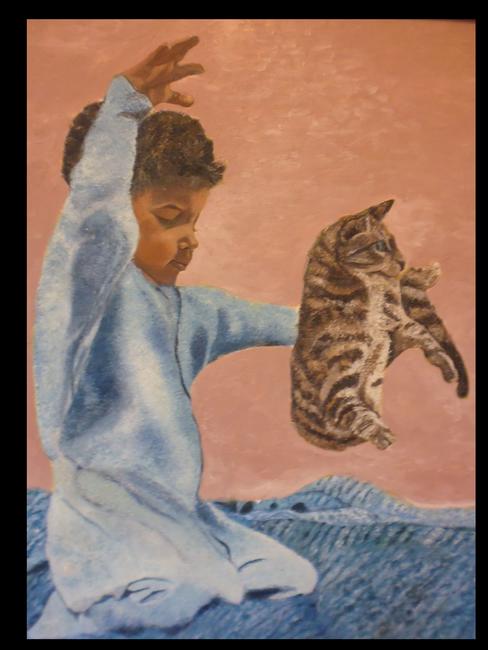 boy playing with cat