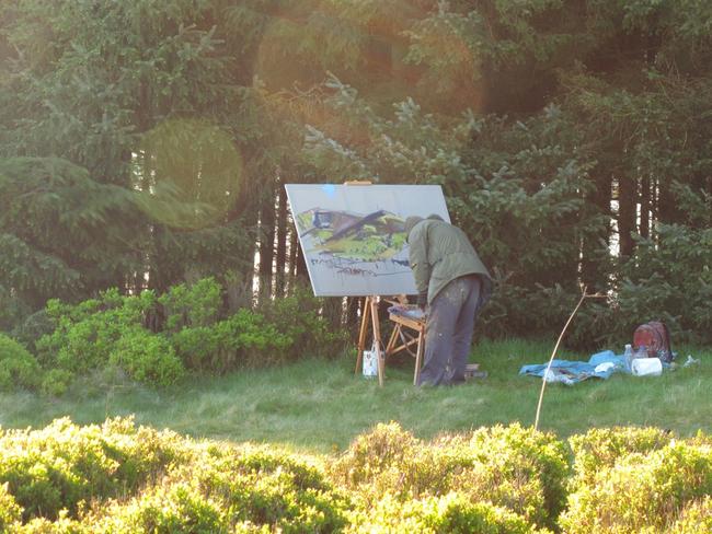 Ian painting at sunrise on Becon Fell