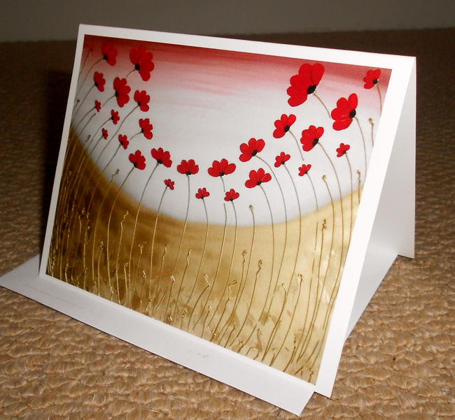 A premium glossy folded card. Print of my painting, 'Red Poppy Field' Blank inside. Comes with white envelope and cellophane sleeve.