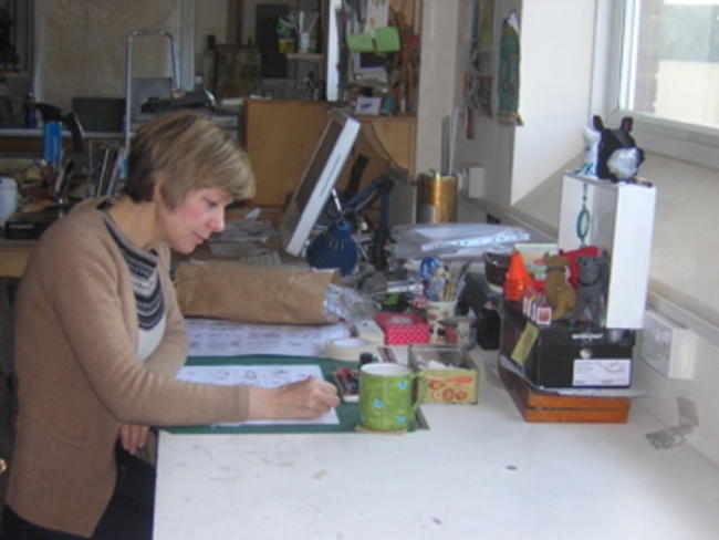 Anna working at her desk.
