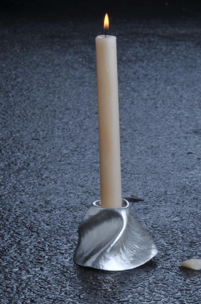 Three-cornered candleholder