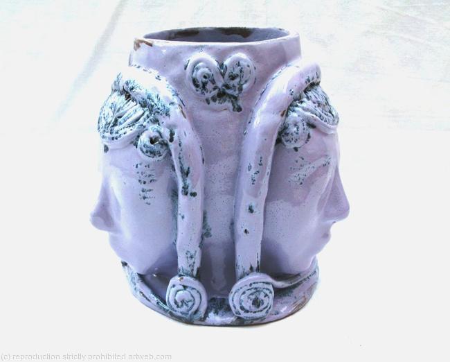 Terracotta bowl with female faces -view 1