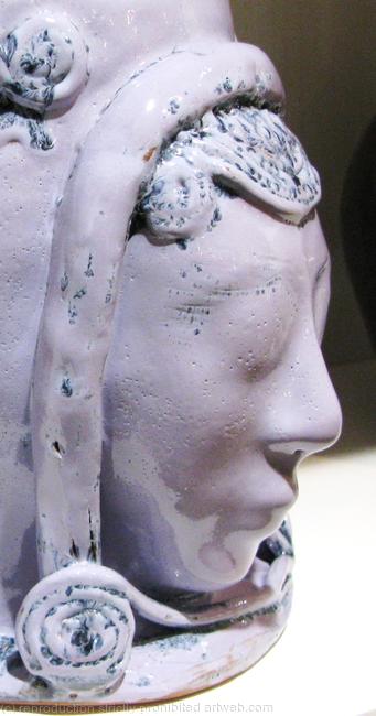 Terracotta bowl with female faces - detail