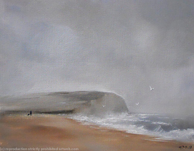 Man and dog on a stormy beach
