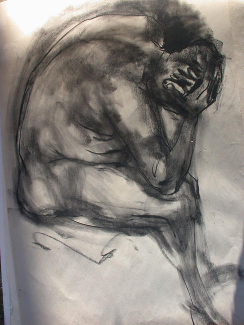 seated male crouching