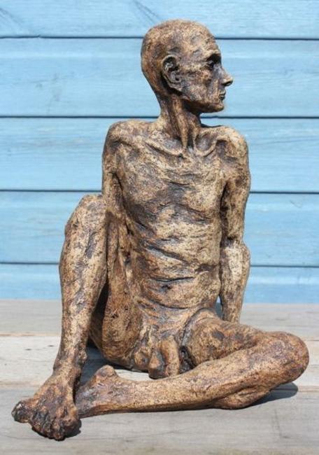 seated tall thin man