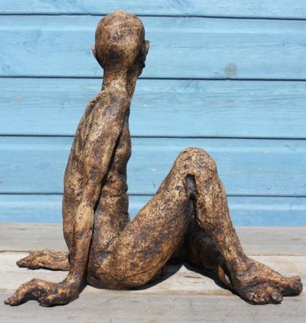 tall thin man seated