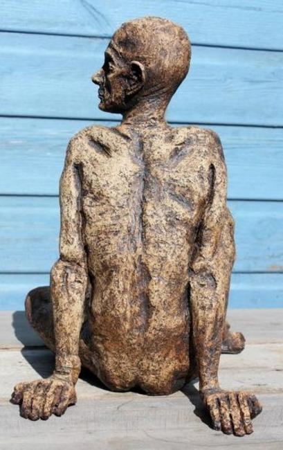 tall thin man seated