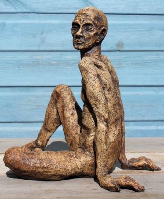 tall thin man seated