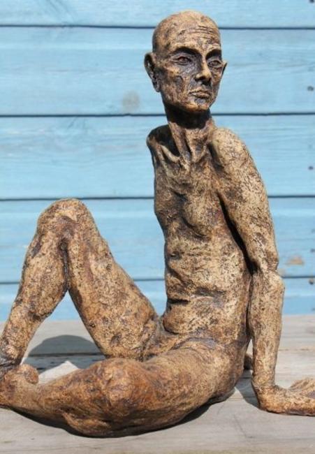 tall thin man seated