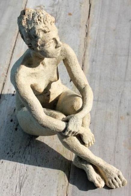 girl hugging her knees