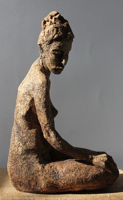 seated woman looking down