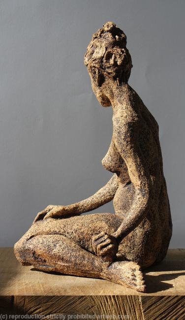 seated woman looking down