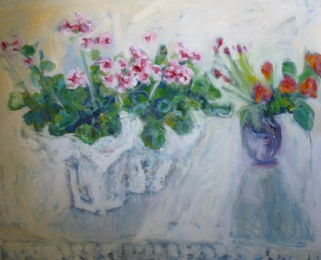Pink geranium, orange roses, tablecloth