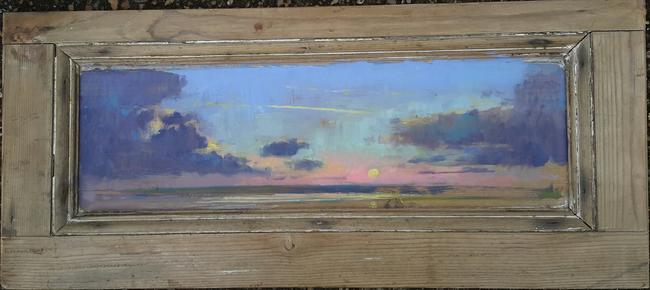 Pink sky on wooden door