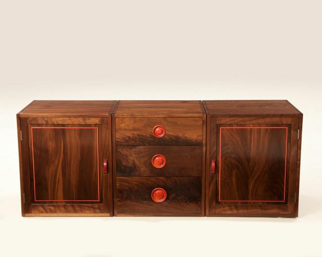 Solid Black American Walnut fully jointed cabinets showing hand cut dovetails on carcus and Drawers. All detail work and handles in rare Pink Ivory wood