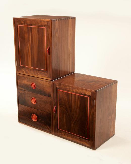 Solid Black American Walnut fully jointed cabinets showing hand cut dovetails on carcus and Drawers. All detail work and handles in rare Pink Ivory wood