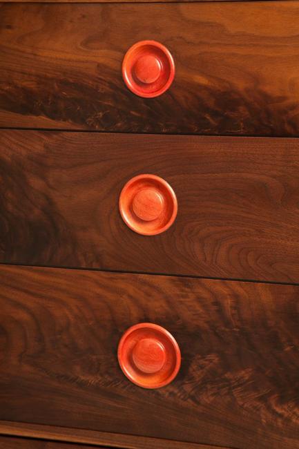 solid Black American Walnut fully jointed cabinets showing hand cut dovetails on carcus and Drawers. All detail work and handles in rare Pink Ivory wood