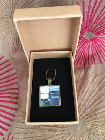 Medium sized pendant with blue and white
