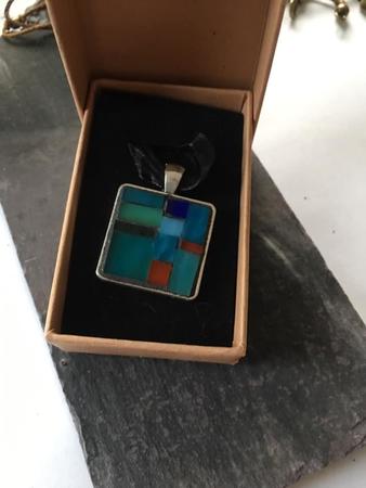 silver tone square pendant