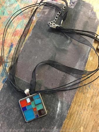 Silver tone alloy with stained glass