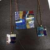 Pendants displayed on my mosaic slate