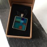 silver tone square pendant