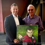 Presenting his portrait to Nigel Owens