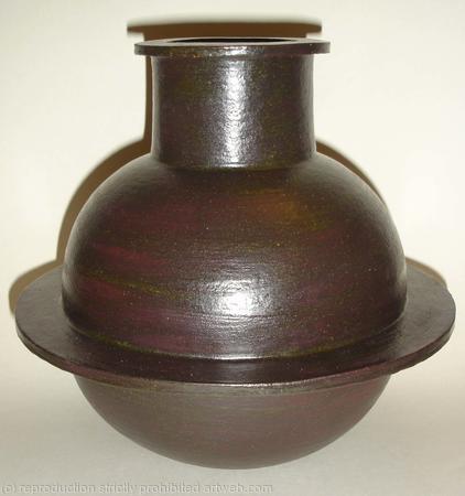 Black stoneware pot with single fin.