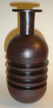 Black stoneware bottle with three ribs