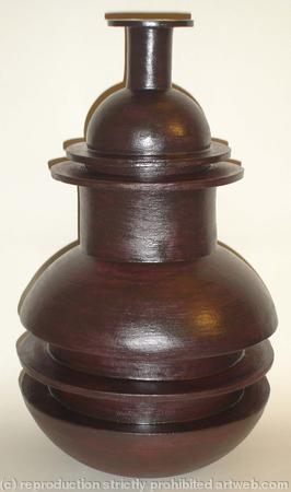 Black stoneware bottle with central rib
