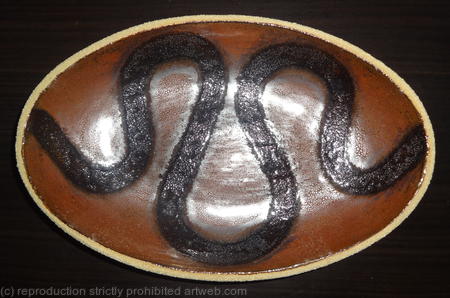 Metallic red 'snake' dish