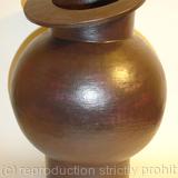 Black stoneware pot with tilted rim