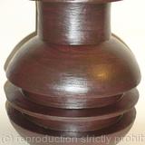 Black stoneware pot with single central rib