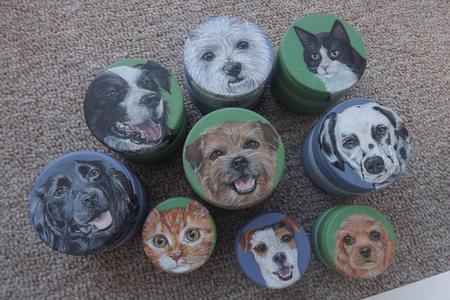 Miniature pet portraits on boxes