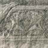 Carved pattern beneath  textile